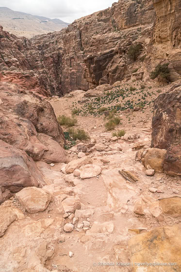 Trail going downhill into the rocky valley.