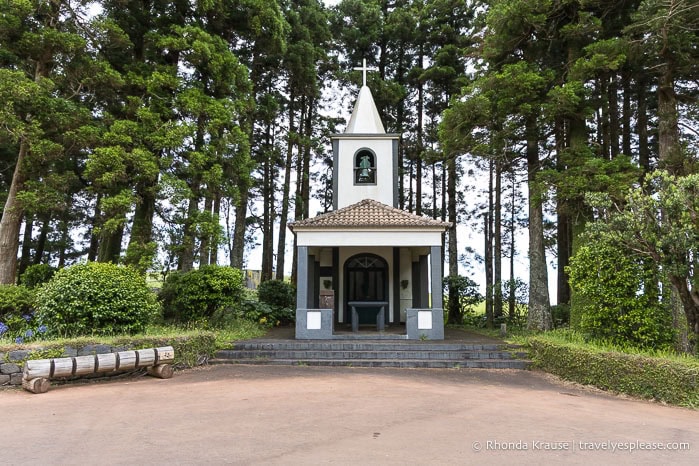 White chapel in a forest. 