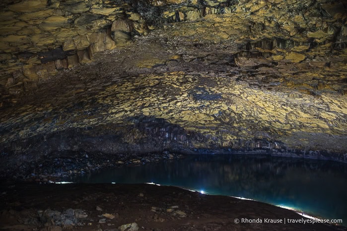 Lake and vaulted roof inside the Furna do Enxofre cave.