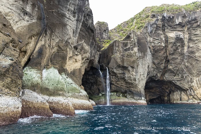 Waterfall at the entrance to a sea cave on Flores Island. 
