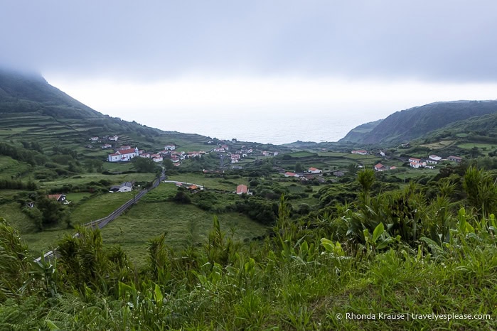 A small village framed by cliffs. 