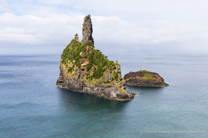 Two rock formations in the ocean. 